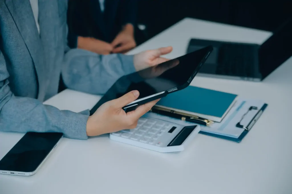 Business professionals reviewing a digital tablet in an office